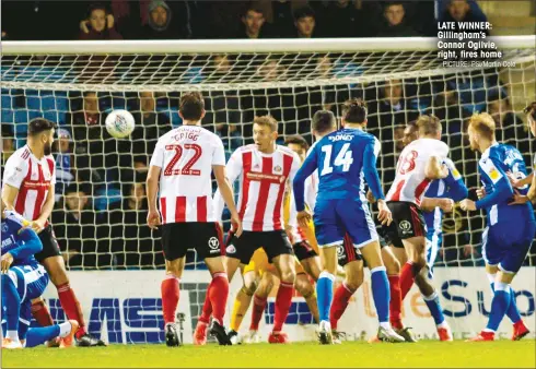  ?? PICTURE: PSI/Martin Cole ?? LATE WINNER: Gillingham’s Connor Ogilvie, right, fires home