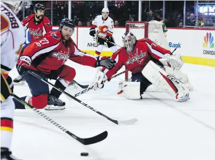  ?? MOLLY RILEY/THE ASSOCIATED PRESS ?? Braden Holtby was solid in net and the Washington Capitals kept the Calgary Flames at bay to win 4-2 Tuesday.