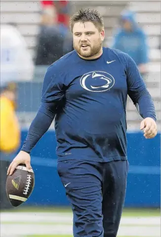  ?? Chris Knight Associated Press ?? PENN STATE sophomore Joey Julius’ 5-foot-10, 271-pound build is highly unusual for a kicker. He suffers from binge eating disorder, a fact he kept to himself until revealing it on Facebook on Oct. 3.