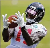  ?? CURTIS COMPTON / CCOMPTON@ AJC.COM ?? After concerns about a possible holdout, Julio Jones hasn’t missed a practice, and coaches have been pleased with his efffforts.