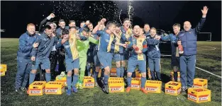  ??  ?? Dutch of class Jubilant Kilby players celebrate with the crates of beers delivered by Ajax