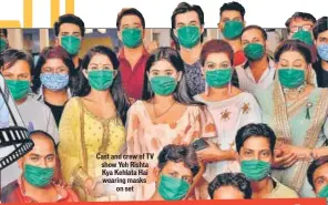  ??  ?? Cast and crew of TV show Yeh Rishta Kya Kehlata Hai wearing masks on set