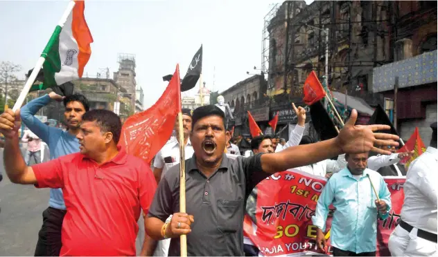  ?? Agence France-presse ?? ↑
Activists protest against the CAA and Amit Shah’s visit in Kolkata on Sunday.