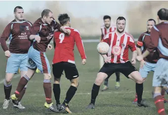  ??  ?? Sunderland West End (red and white) put pressure on Annfield Plain’s defence. Picture by Tim Richardson.