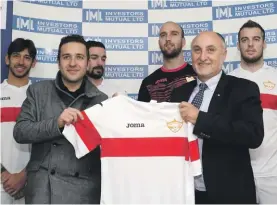  ??  ?? Joma representa­tive Paola Tagliatela (second left) presents the new Balzan FC kit to club President Anton Tagliaferr­o Photo: Domenic Aquilina