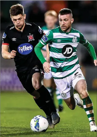  ??  ?? Jack Byrne of Shamrock Rovers is chased by Cammy Smith of Dundalk.