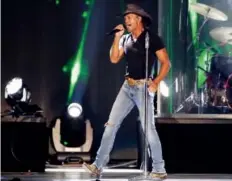  ?? GENE J. PUSKAR/THE ASSOCIATED PRESS ?? Some gun-rights advocates criticized Tim McGraw for performing at a benefit concert for victims of the Sandy Hook mass murder.