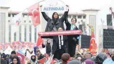  ?? ?? Justice and Developmen­t (AK) Party’s supporters attend an election campaign rally in Ankara on March 23. — AFP