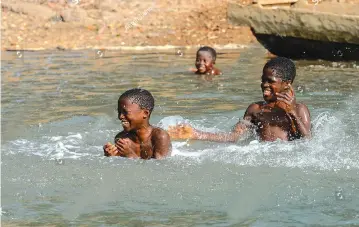  ?? ?? Swimming was one of the most popular pastimes among village boys