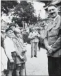  ?? Pictures: C&T Auctioneer­s and Valuers ?? Photos from the collection sold at auction, showing the Fuhrer relaxing at his retreat and smiling with some children