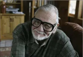  ?? AP FILE PHOTOS ?? Director and writer George Romero poses for a photograph while talking about his film “Diary of the Dead’ at the Sundance Film Festival in Park City, Utah. George Romero, whose classic “Night of the Living Dead” and other horror films turned zombie...