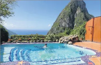  ?? PHOTO BY SANDRA NOWLAN ?? Plunge pool and a view of Pitons from Ladera Resort.