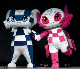  ?? GETTY IMAGES ?? Tokyo 2020 Olympic mascots Miraitowa, left, and Someity.