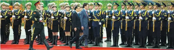  ??  ?? Prime Minister Justin Trudeau takes part Monday in a welcoming ceremony with Chinese Premier Li Keqiang at the Great Hall of the People in Beijing.