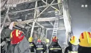  ?? ?? This screen grab shows rescuers responding to a fire at an industrial wholesaler in Henan, China, Nov. 21, 2022.