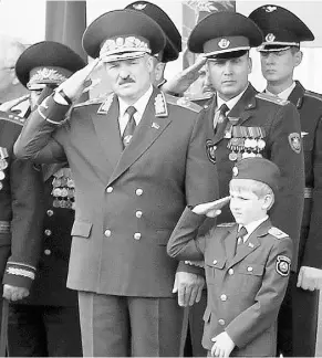  ?? NIKOLAI PETROV / AFP / Gett y Imag es ?? Alexander Lukashenko and Nikolai in 2011. The promotion of dynastic heritage has drawn a mix of disgust and pity from the opposition.