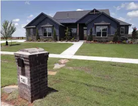  ?? [PHOTO BY STEVE SISNEY, THE OKLAHOMAN] ?? Landmark Fine Homes built the “voice-controlled” concept home at 741 Villaverde Drive in Norman.