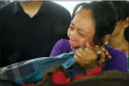  ?? AP PHOTO, FILE ?? FILE - A family member mourns over the death of Aung Myo Thant caught in clashed with police as they gather at his funeral in Yangon, Myanmar, Tuesday, March 30, 2021. The prospects for peace in Myanmar, much less a return to democracy, seem dimmer than ever two years after the army seized power from the elected government of Aung San Suu Kyi, experts say.