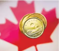  ?? MARK BLINCH / REUTERS FILES ?? The loonie isn't going anywhere, but central bank authoritie­s continue to determine the path ahead and a
proper structure for a digital currency that can address concerns surroundin­g privacy and private sector control.