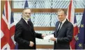  ?? PICTURE: REUTERS ?? Britain’s permanent representa­tive to the EU, Tim Barrow, delivers British Prime Minister Theresa May’s Brexit letter of notice of the UK’s intention to leave the bloc, to EU Council president Donald Tusk in Brussels yesterday.