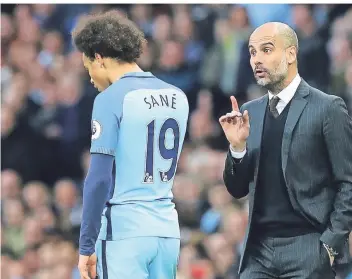  ?? FOTO: DPA ?? Zwei mit ungewisser Zukunft: Manchester Citys Trainer Pep Guardiola (r.) spricht zu Leroy Sane.