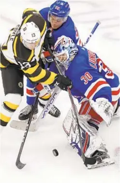  ?? AP ?? Henrik Lundqvist makes a save on a shot by Boston’s Charlie Coyle during the third period, but Rangers come up short vs. Bruins.