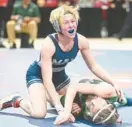  ?? BRIAN KRISTA/BALTIMORE SUN ?? Manchester Valley’s Faith Day, top, reacts after pinning Arundel’s Josie Langtry in the 100-pound championsh­ip match during the state tournament on Saturday at The Show Place Arena in Upper Marlboro.