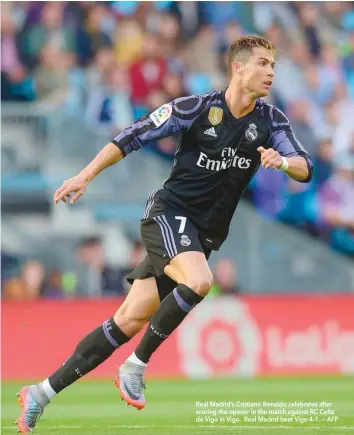  ?? Real Madrid’s Cristiano Ronaldo celebrates after scoring the opener in the match against RC Celta de Vigo in Vigo. Real Madrid beat Vigo 4-1. — AFP ??