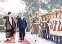  ?? Reuters ?? Iranian President Ebrahim Raisi walks with Iraqi Prime Minister Mohammed Shia al Sudani during a welcoming ceremony in Tehran. —