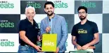  ??  ?? First delivery through the app handed over to Harpo Group of Restaurant­s Owner Harpo Gooneratne by Uber Eats India and South Asia Head Bhavik Rathod