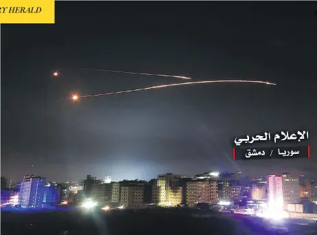  ?? STR / AFP / CENTRAL WAR MEDIA / GETTY IMAGES ?? Syrian air defence systems intercept Israeli missiles over Damascus in images released by the Syrian government-affiliated Central War Media. Israel’s army said it launched raids overnight against Iranian targets in Syria after its forces were...