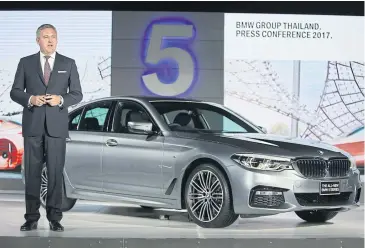  ??  ?? BMW Group Thailand president Stefan Teuchert presents the all-new BMW 5 Series sedan.