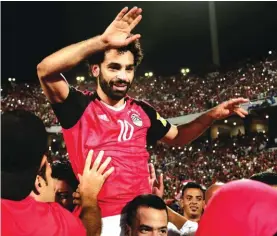  ??  ?? Egypt’s Mohamed Salah celebrates defeating Congo