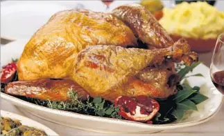  ?? Kirk McKoy Los Angeles Times ?? A NO-FUSS roasted turkey can be juicy and burnished, leaving enough pan drippings for gravy.