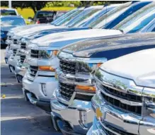  ?? ASSOCIATED PRESS FILE PHOTO ?? Chevrolet trucks are lined up at a Chevrolet dealership in Richmond, Va.