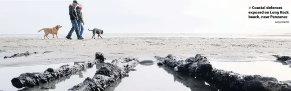  ?? Greg Martin ?? > Coastal defences exposed on Long Rock beach, near Penzance