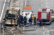  ?? BTA AGENCY BULGARIA VIA AP ?? Firefighte­rs and forensic workers inspect the scene of a bus crash on a highway near the village of Bosnek, western Bulgaria, Tuesday.