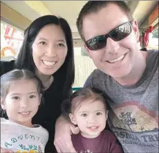  ??  ?? TRISTAN BEAUDETTE with his wife, Erica Wu, and their daughters. The girls were with him when he was shot to death in a tent.