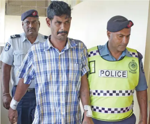  ?? Photo: Ronald Kumar ?? Bus driver, Salesh Jattan is escorted by Police officers at the Magistrate­s Court in Nausori during a special court sitting on October 12, 2019.