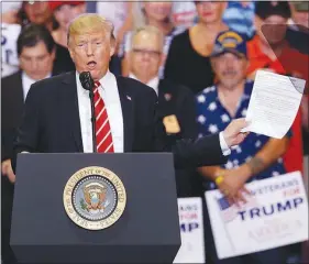  ?? RICK SCUTERI / AP ?? President Donald Trump gestures to the crowd while speaking Tuesday at a rally at the Phoenix Convention Center. In addition to his usual railing against the media and “anarchists” on the left, Trump also was again critical of members of Congress from...