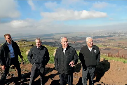  ?? AP ?? Israeli Prime Minister Benjamin Netanyahu, centre, Republican US Senator Lindsey Graham, second left, and US Ambassador to Israel David Friedman, right, visit the border between Israel and Syria at the Israeli-held Golan Heights earlier this month.