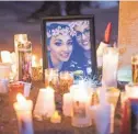  ?? MICHAEL CHOW/USA TODAY NETWORK ?? A candleligh­t vigil is held for Jovanna Calzadilla­s on Oct. 8, 2017. She was hit during the Las Vegas mass shooting. A year later, after much therapy, she is able to stand and walk short distances with help.