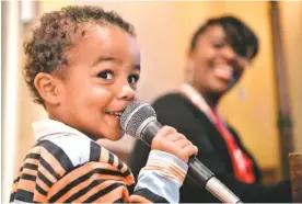  ??  ?? Three-year-old Antonio Westfield sings “Jesus Loves Me” with his aunt, Della Chislom, at Ridgedale Baptist Church.