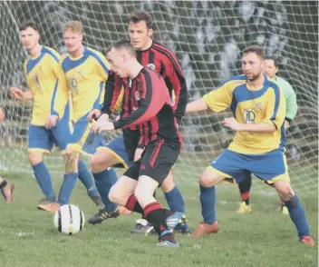  ??  ?? West Pier Reserves’ Lewis Short wins a header in their 4-1 defeat against Filey Town Reserves (above left), before trying to find a way through to the Filey Town goal (above right) Pictures by Steve Lilly