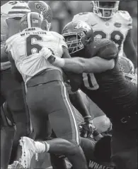  ?? Hawgs Illustrate­d/JASON IVESTER ?? Arkansas senior offensive tackle Dan Skipper (right) blocks Florida defensive back Quincy Wilson during the Razorbacks’ 3110 victory over the Gators on Nov. 5. On Tuesday, Skipper was named first-team All-SEC by the conference’s coaches. Wilson was...