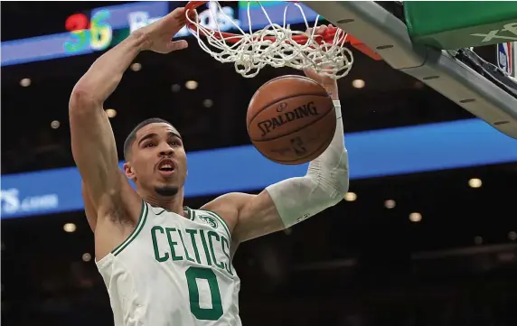  ?? MATT STONE PHOTOS / HERALD STAFF FILE ?? COUNT IT: A bulked-up Jason Tatum dunks during a game against the Cleveland Cavaliers at the TD Garden on Jan. 23.