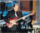  ?? Jeff Kravitz FilmMagic ?? INFLUENTIA­L MUSICIAN Nokie Edwards performs at the Ventures’ Rock & Roll Hall of Fame induction ceremony in 2008.