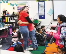  ?? AP/The Denver Post/RJ SANGOSTI ?? Hannah Maldonado, a first-grade teacher at Barnum Elementary, gets a hug from 7-year-old Jayden Gomez welcoming her back to class Thursday after Denver teachers ended a three-day strike.