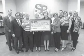  ?? Submitted photo ?? State Bank recently presented a $50,000 scholarshi­p donation to Texas A&M University­Texarkana. Pictured are, front row from left, Joe Nichols, Chris Moser, Janie Matteson, Dr. Emily Cutrer, Mary Ann Oden, Cris Day and LeAnne Wright and back row from...
