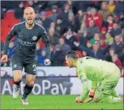  ?? REUTERS PHOTO ?? David Silva (left) scored both the goals in Manchester City’s 20 win over Stoke City on Monday.